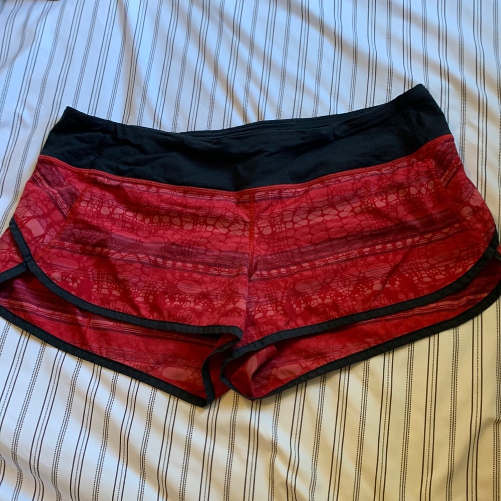 Red print Lululemon shorts with black lining